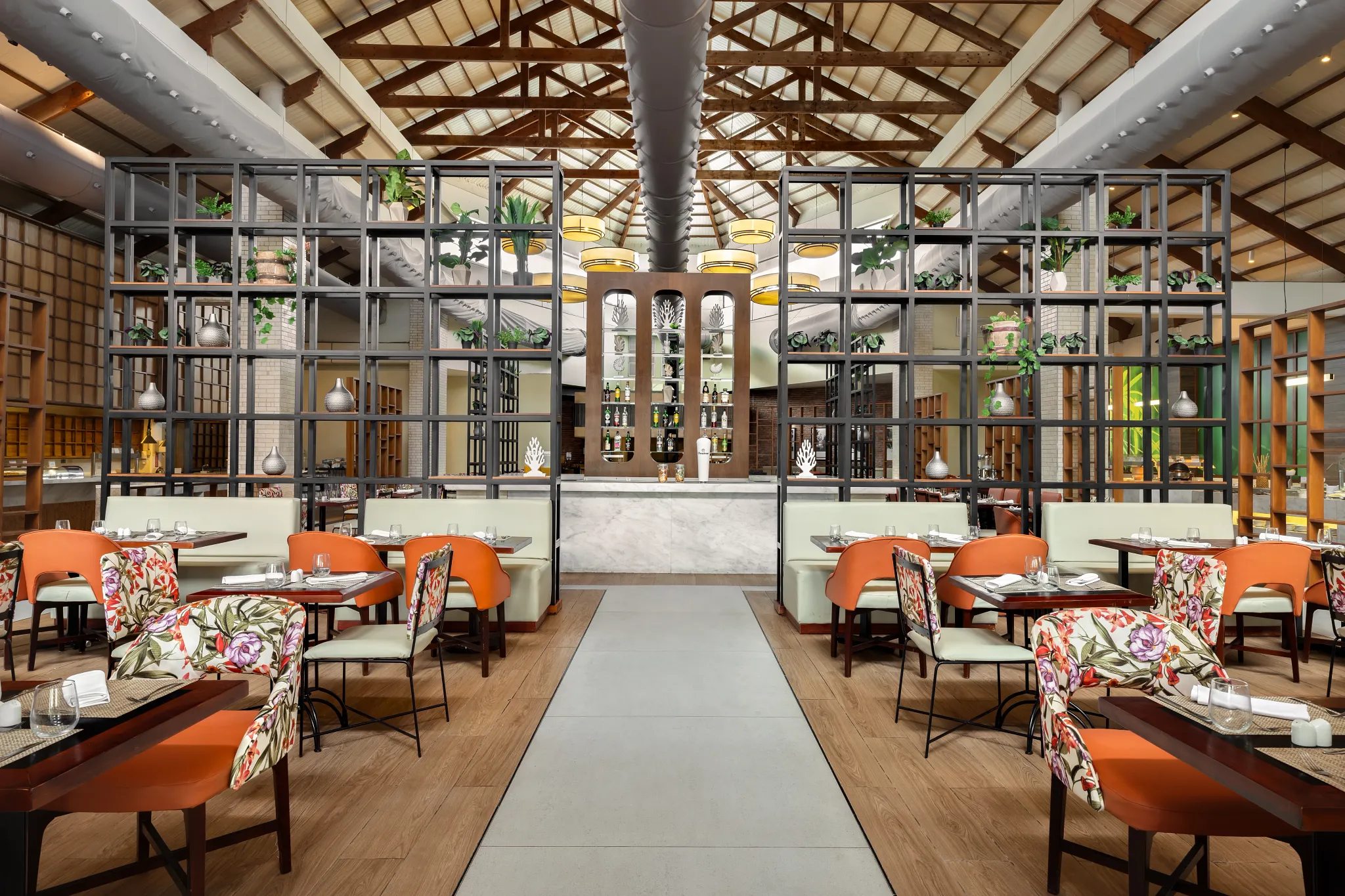 Kaleidoscope restaurant at Sunscape Coco Punta Cana featuring colorful contemporary décor, elegant dining tables, and an inviting international buffet atmosphere.