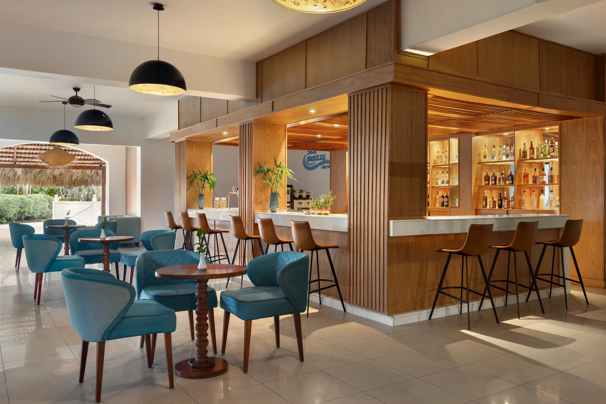 Sea Breeze bar at Sunscape Coco Punta Cana featuring open-air tropical seating, oceanfront views, and refreshing Caribbean cocktails.
