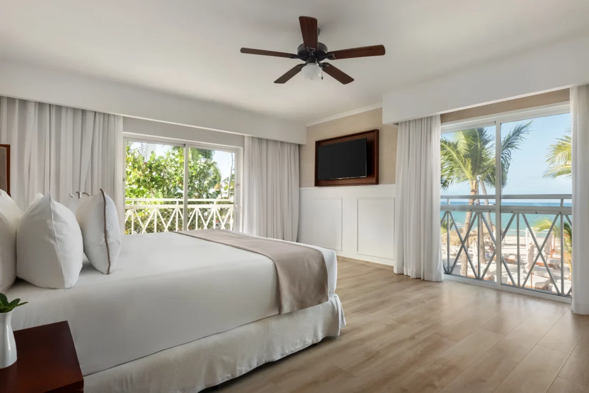 Sun Club 2-Bedroom Family Suite Ocean Front with king bed and ocean-view balcony at Sunscape Coco Punta Cana.