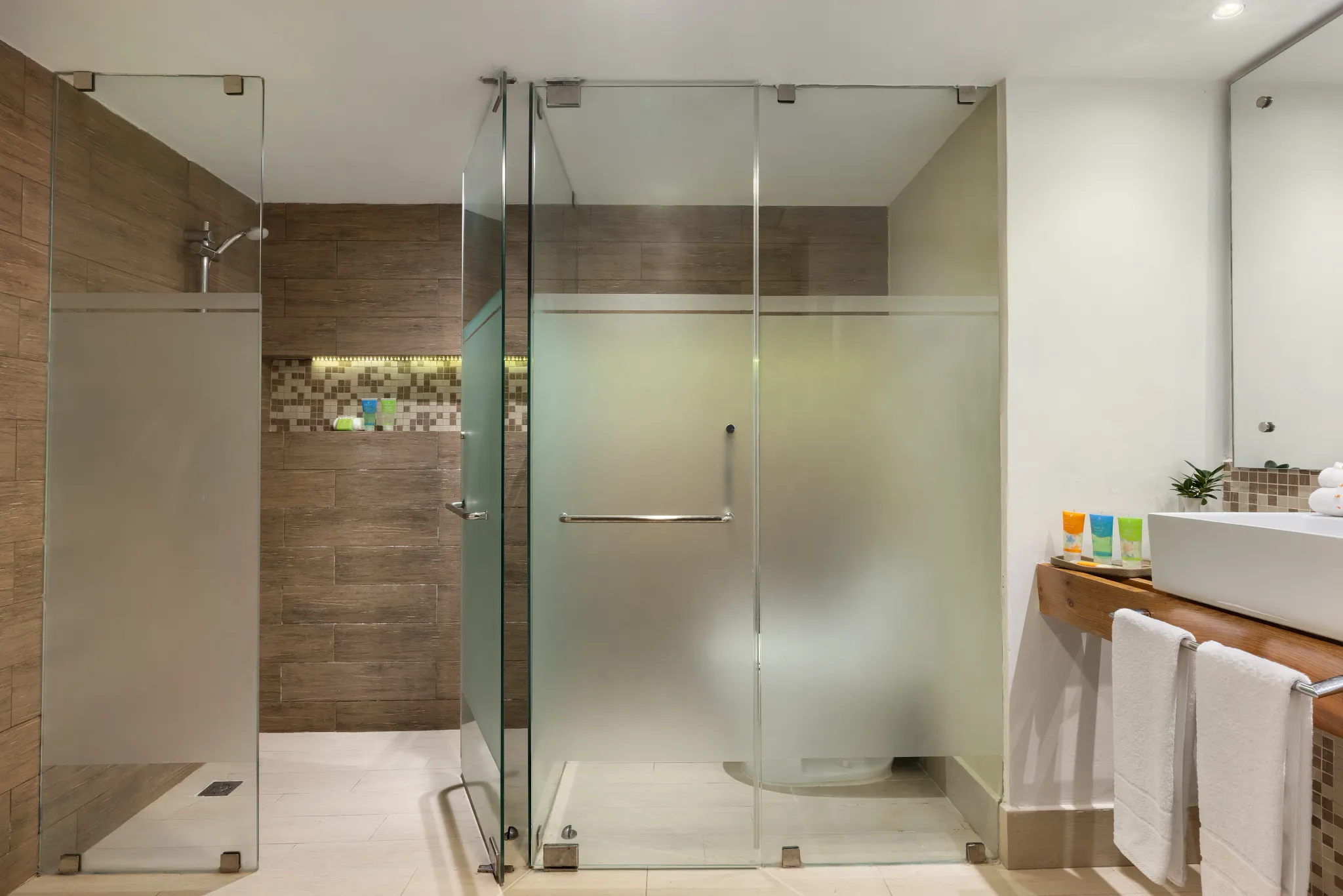 Sun Club 3-Bedroom Family Suite Tropical View bathroom with glass walk-in shower at Sunscape Coco Punta Cana.