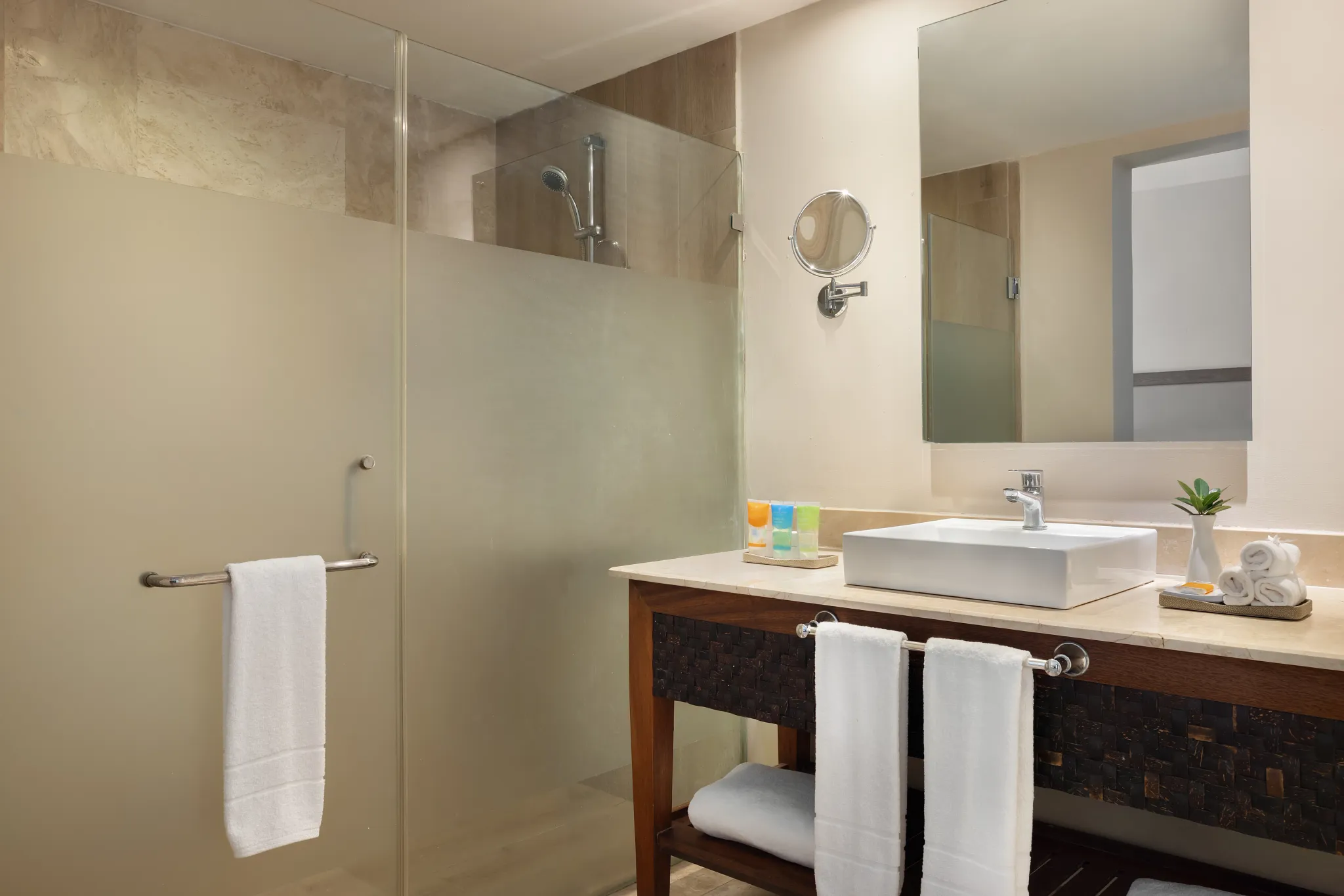 Sun Club Junior Suite Pool Access bathroom with walk-in shower and modern vanity at Sunscape Coco Punta Cana.
