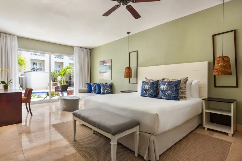 Sun Club Junior Suite Pool Access with king-size bed and terrace at Sunscape Coco Punta Cana.