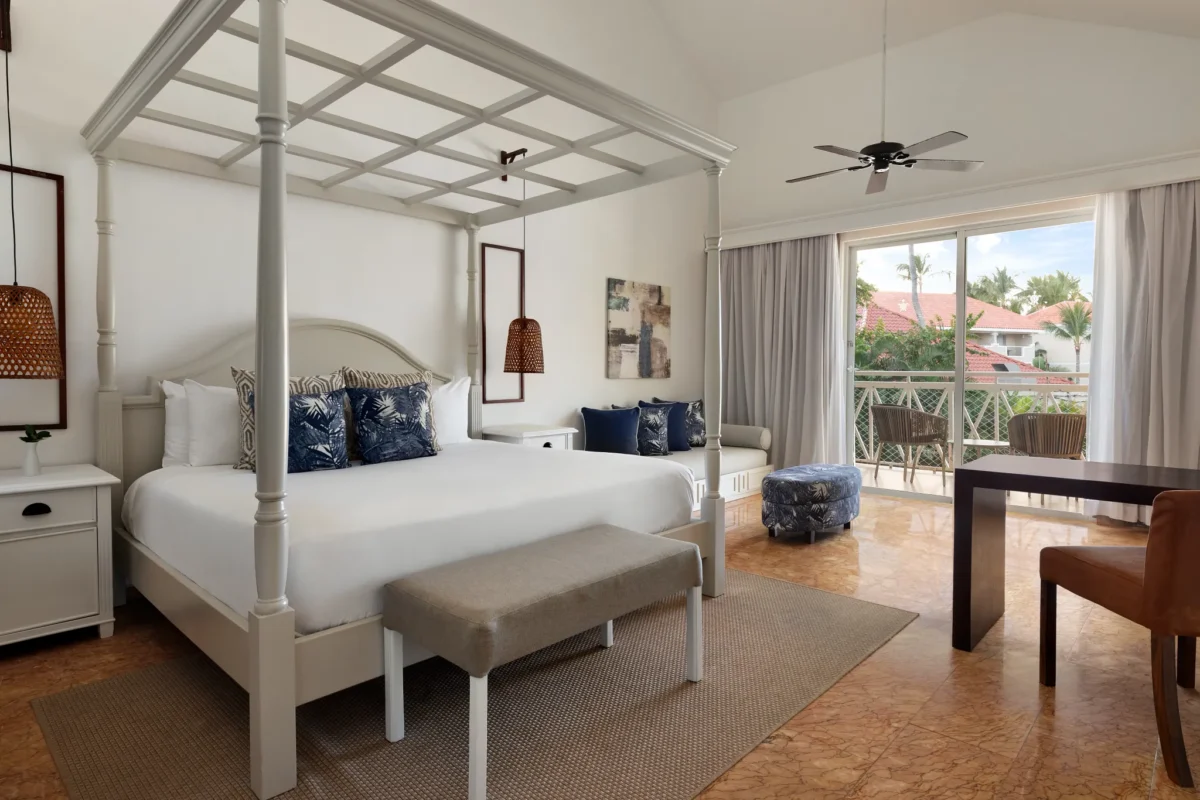 Premium suite with king bed, private balcony, and pool or ocean views at Sunscape Coco Punta Cana.