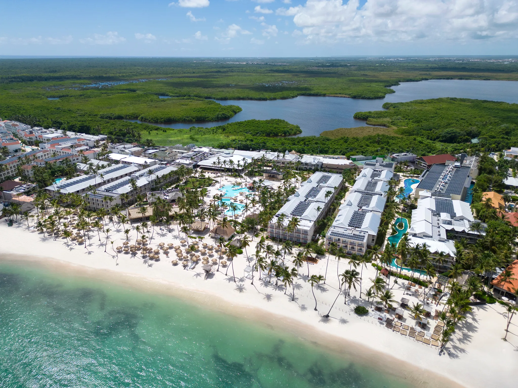 Sunscape Coco Punta Cana family-friendly all-inclusive resort with tropical pools, white sand beach, and palm trees in the Dominican Republic.