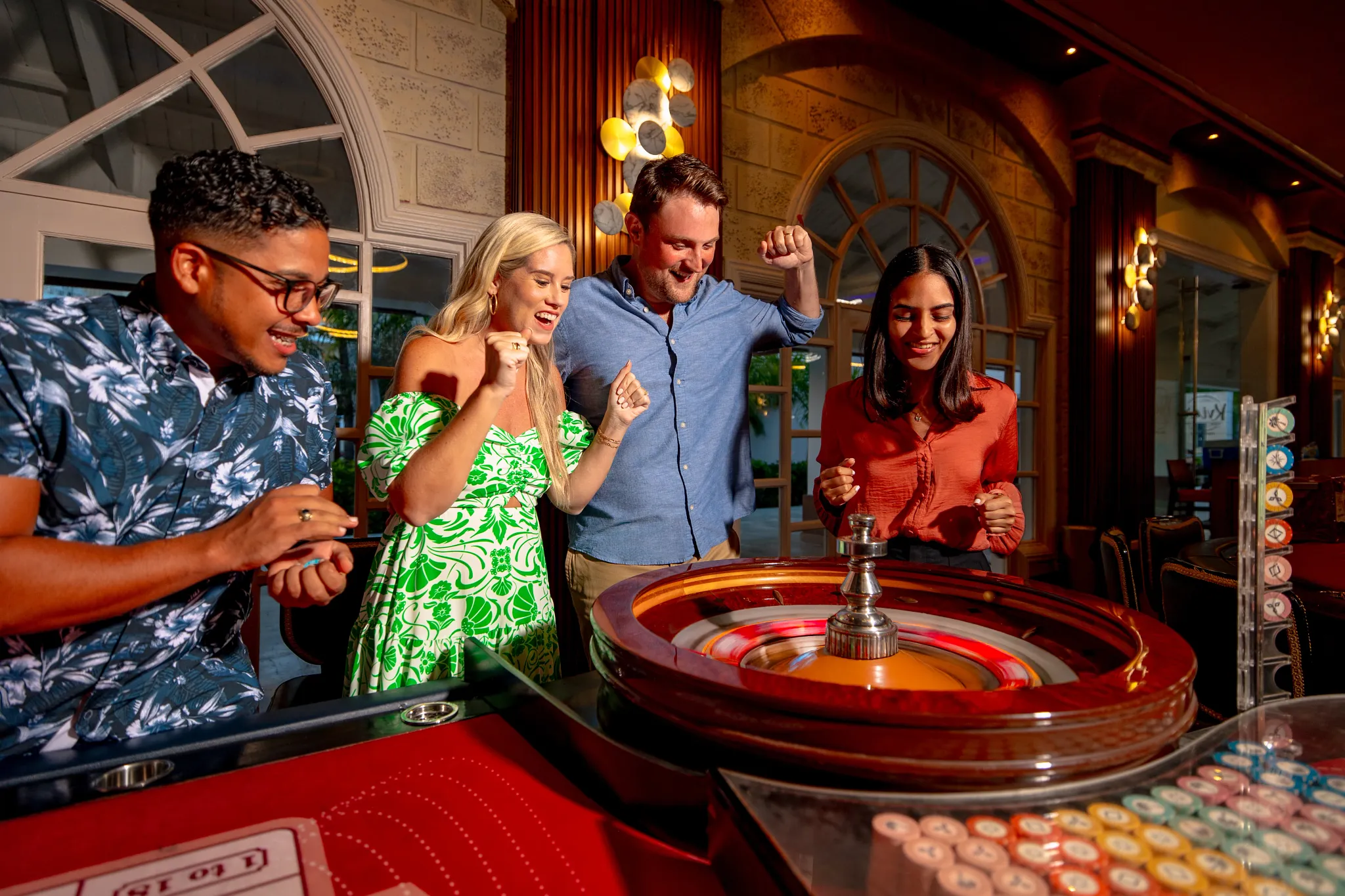 Guests enjoying casino entertainment and roulette gaming at Sunscape Coco Punta Cana Resort.
