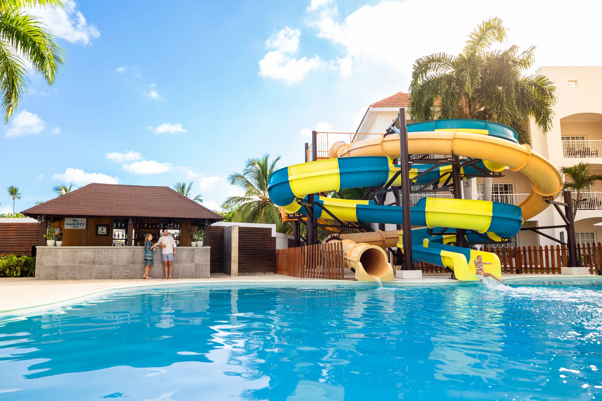 Colorful family water slides and pool area at Sunscape Coco Punta Cana Resort.