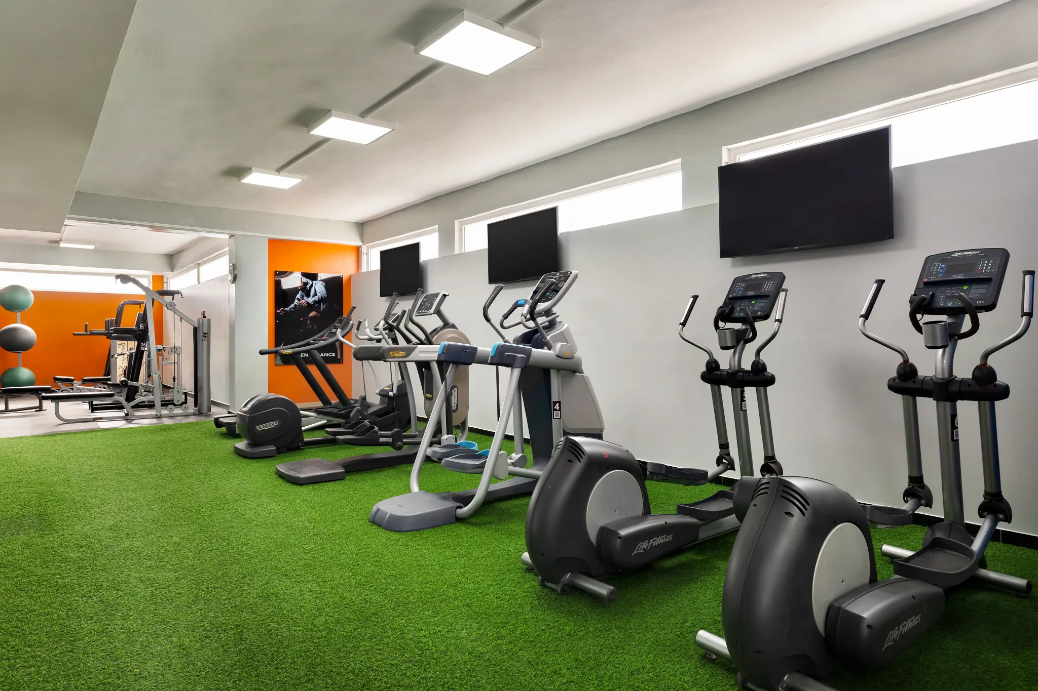 Modern fitness center with cardio equipment at Sunscape Coco Punta Cana Resort.