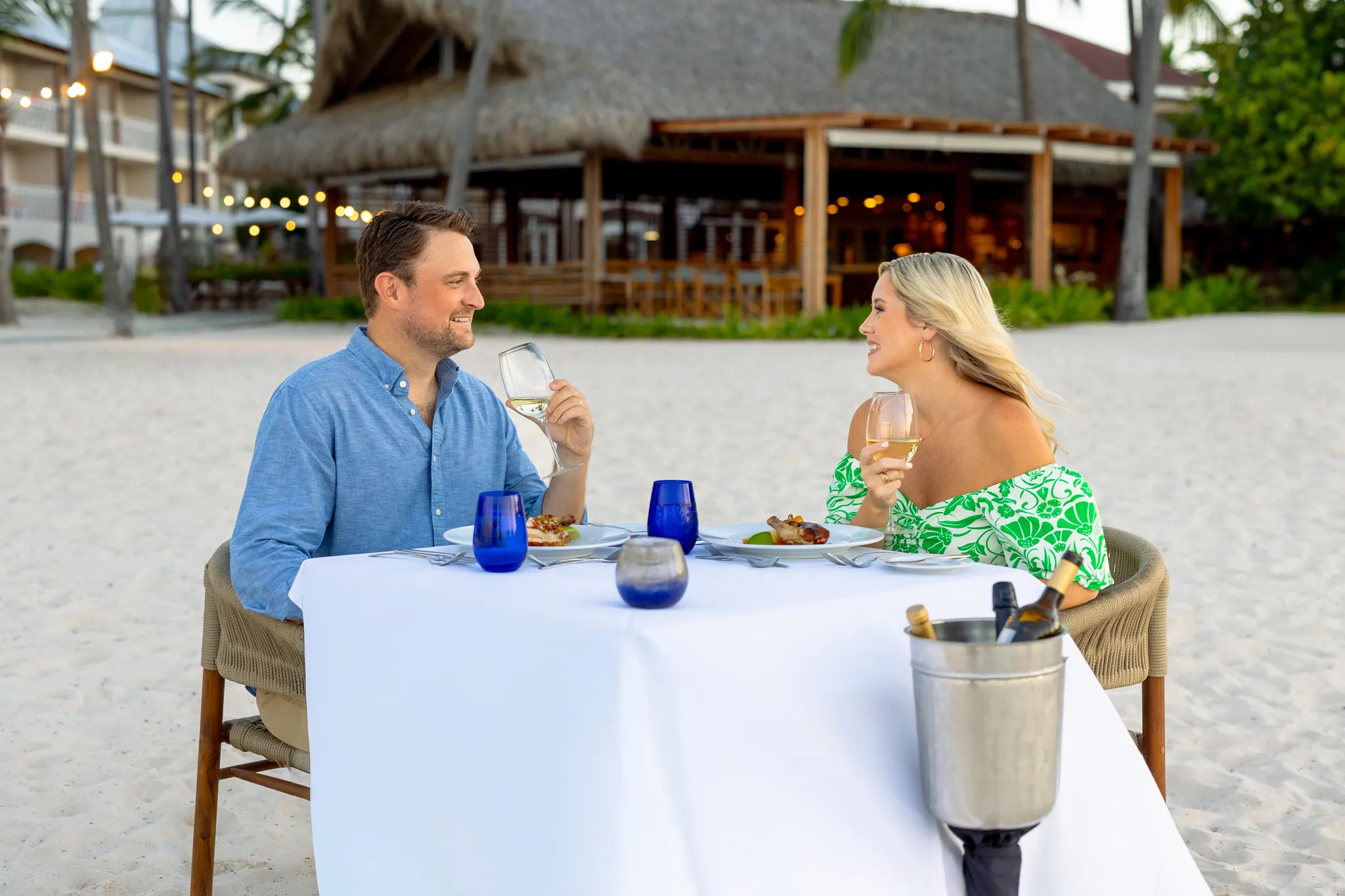 Romantic private dinner setup on the beach at Sunscape Coco Punta Cana with ocean views and candlelight ambiance.