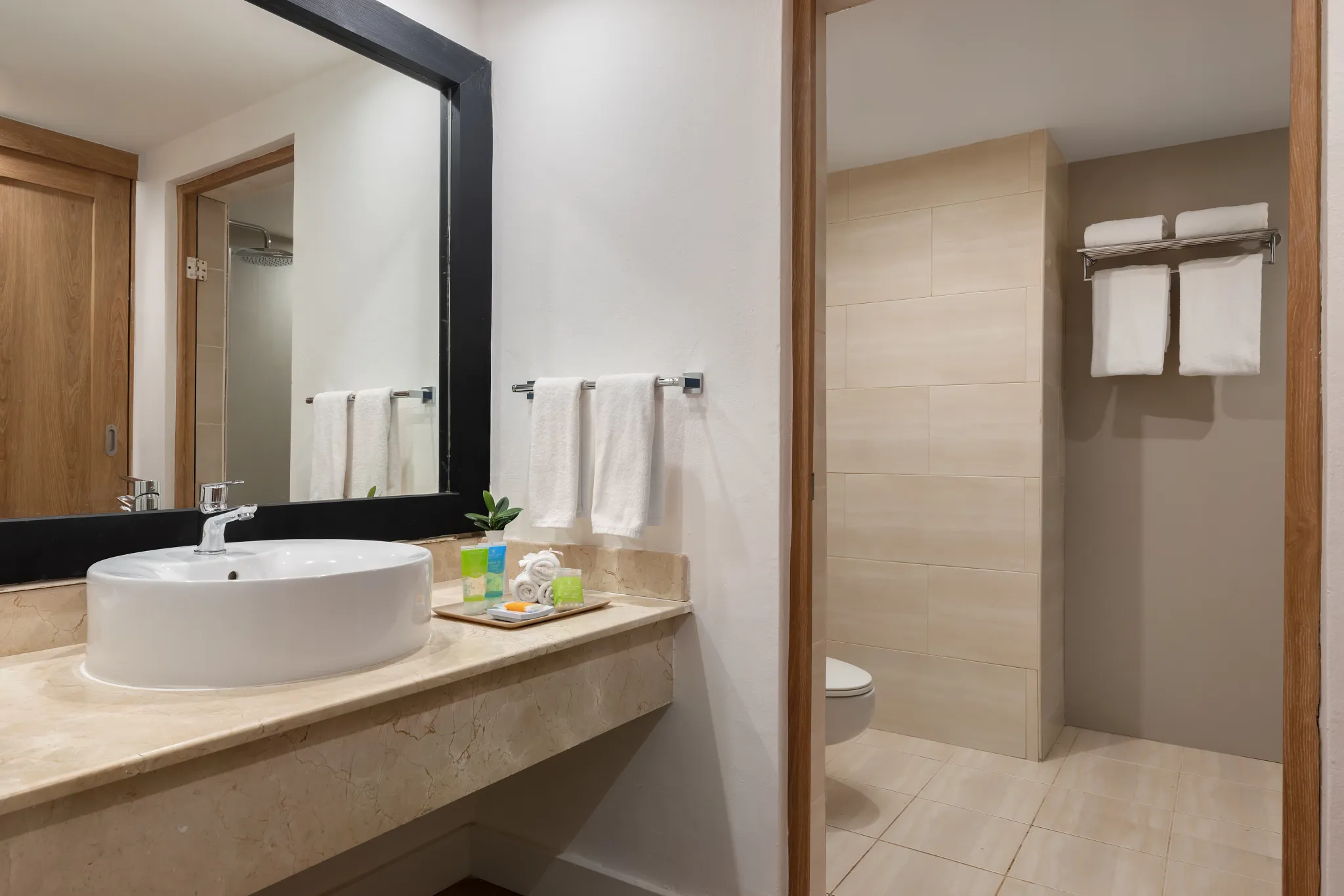 Superior Deluxe Ocean View bathroom with modern vanity and walk-in shower at Sunscape Coco Punta Cana.