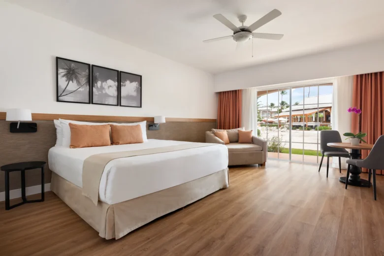Superior Deluxe Ocean View room with king-size bed and private terrace at Sunscape Coco Punta Cana.