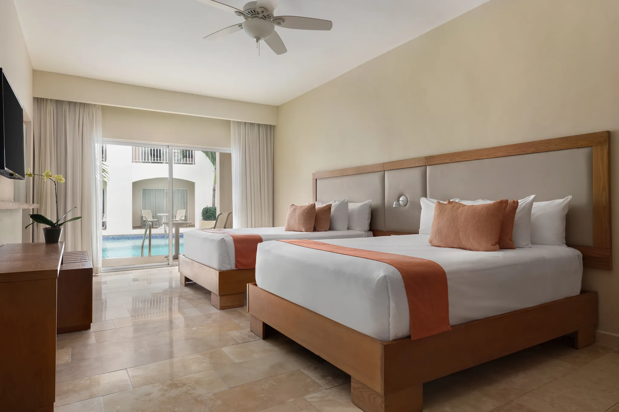 Superior Deluxe Swim Out room with two double beds and direct pool access at Sunscape Coco Punta Cana.