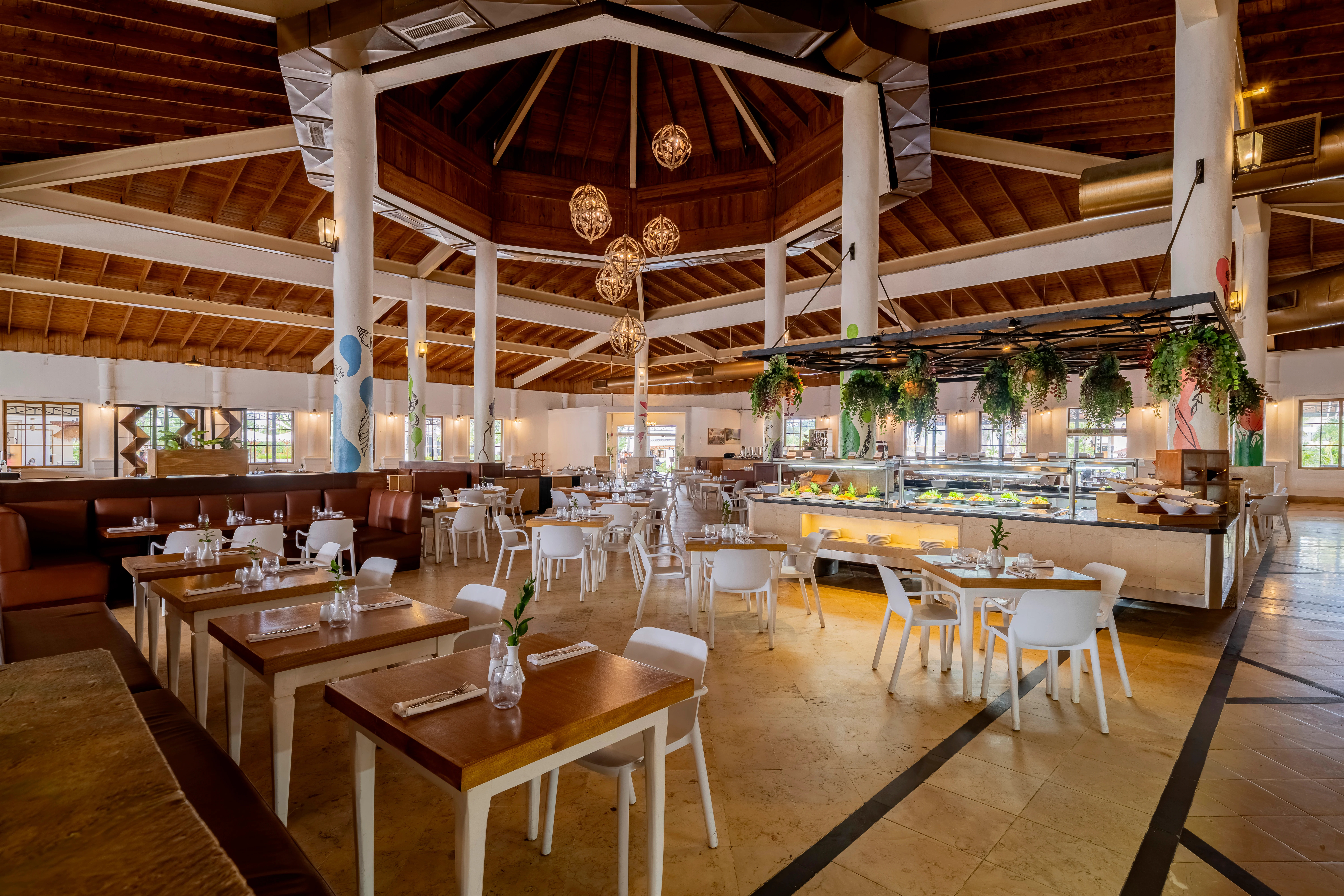 Windows restaurant at Sunscape Coco Punta Cana featuring bright buffet dining, contemporary décor, and panoramic resort views.